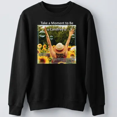 Woman with arms raised in sunflower field, colorful illustration with uplifting text — printed on a unisex sweatshirt