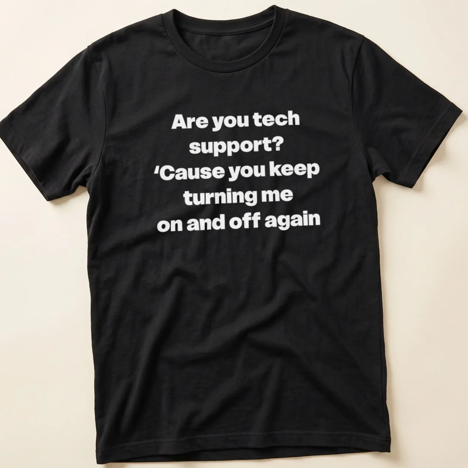 Humorous Tech Support t-shirt with bold printed text about turning devices on and off — printed on a unisex t-shirt