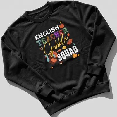 Colorful illustration of a turkey with 'TEACHER Gobble' text in playful font. — printed on a unisex sweatshirt