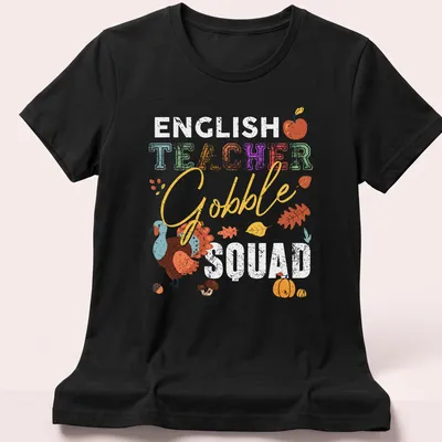 Colorful illustration of a turkey with 'TEACHER Gobble' text in playful font. — printed on a women's shirt