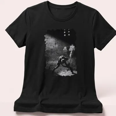 Black and white grunge T-shirt featuring The Clash in a punk rock style — printed on a women's shirt