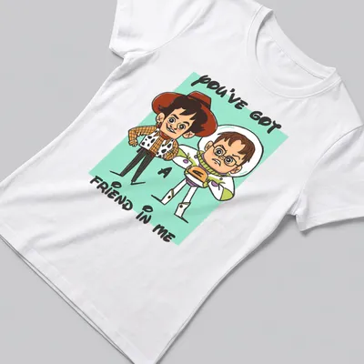 Cartoon design featuring toy characters and the text 'YOU'VE GOT A FRIEND IN ME' in colorful print. — printed on a women's shirt