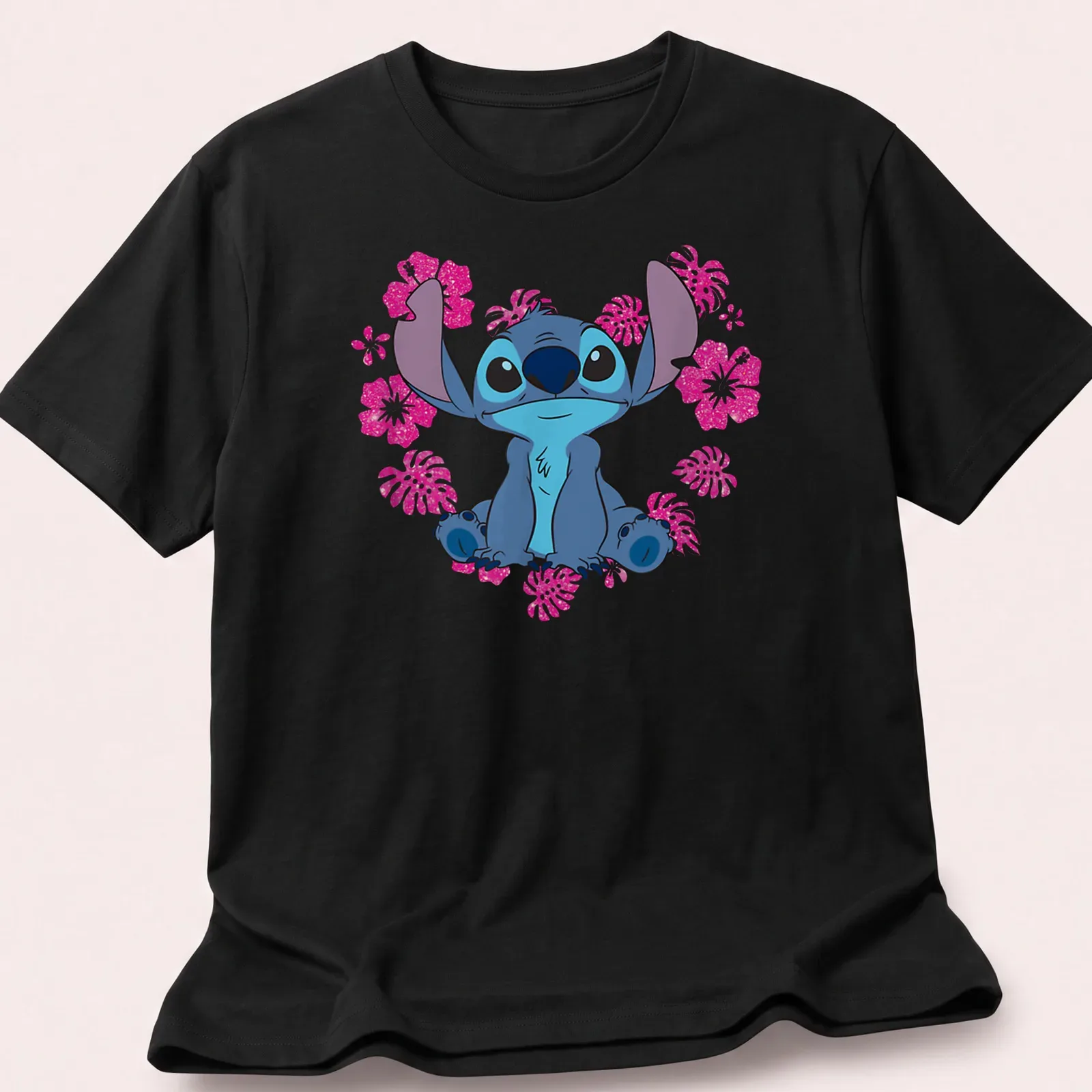 Cartoon alien character Stitch with heart flowers in blue, pink, white, and green. — printed on a unisex t-shirt