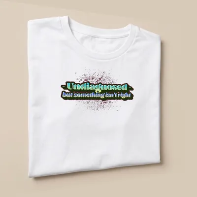 Colorful text design on Undiagnosed shirt with playful typography — printed on a unisex t-shirt (angled view)