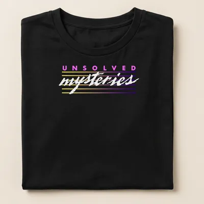 Retro striped tee featuring the text 'UNSOLVED mysteries' in colorful letters. — printed on a women's shirt
