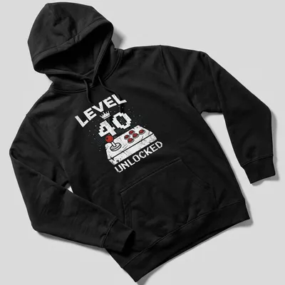 Retro distressed t-shirt with 'LEVEL 40 UNLOCKED' above a video game controller in bright colors — printed on a unisex hoodie