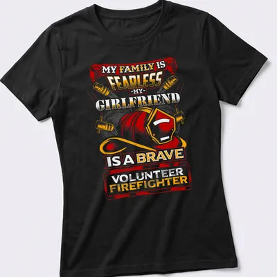 Vintage-style t-shirt celebrating a brave volunteer firefighter girlfriend with bold text and helmet graphic. — printed on a women's shirt