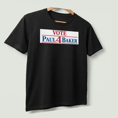 Bold typography t-shirt displaying 'Vote Paul 4 Baker' in red, blue, and white. — printed on a unisex t-shirt (angled view)