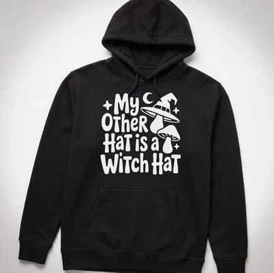 Funny shirt featuring the text My Other Hat Is A Witch Hat with an illustration of a witch hat — printed on a unisex hoodie