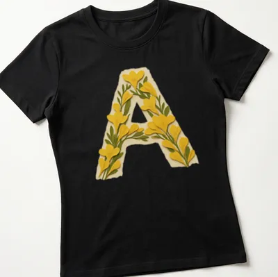 Floral decorated letter A monogram t-shirt in vintage style — printed on a women's shirt